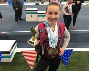 Emma at a gymnastics meet.