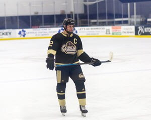 Gavin playing hockey while studying at Lighthouse Connections Academy