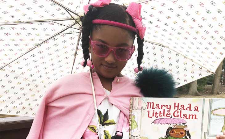 Saige W. with the book, "Mary Had a Little Glam."