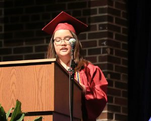 Sarah speaking at her graduation ceremony