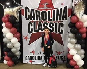Image of Rutger at a gynastics tournament