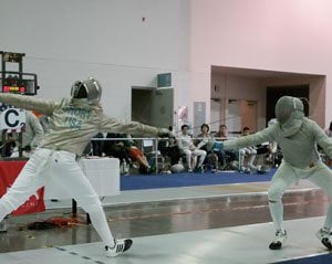 Chaddy fencing against an opponent in a tournament