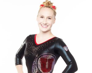 Shannon posing in her gymnastics uniform