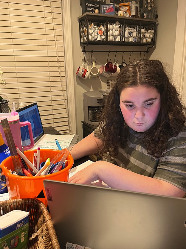 Image of Virginia Connections Academy student Raegyn working on schoolwork.