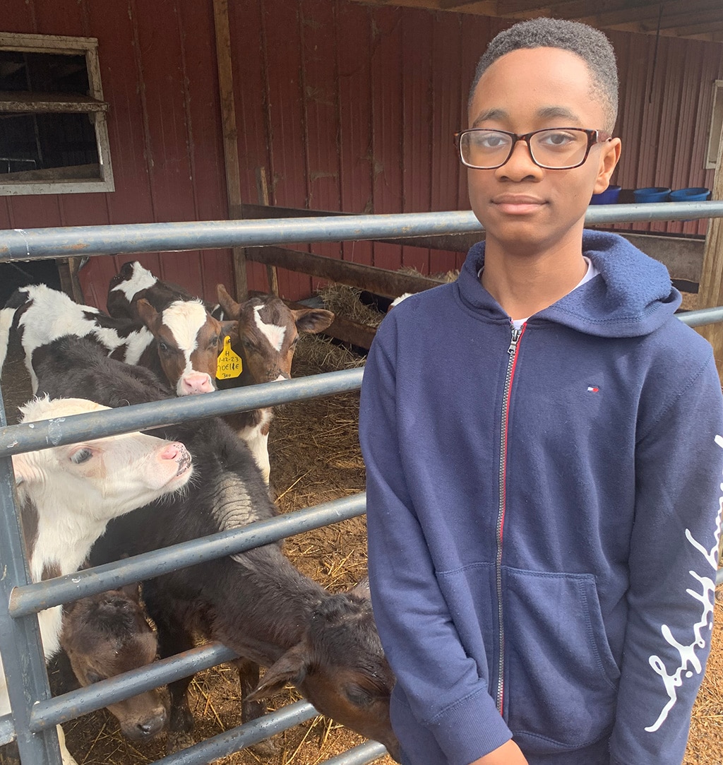 Image of Virginia Connections Academy student Solomon visiting a dairy farm.