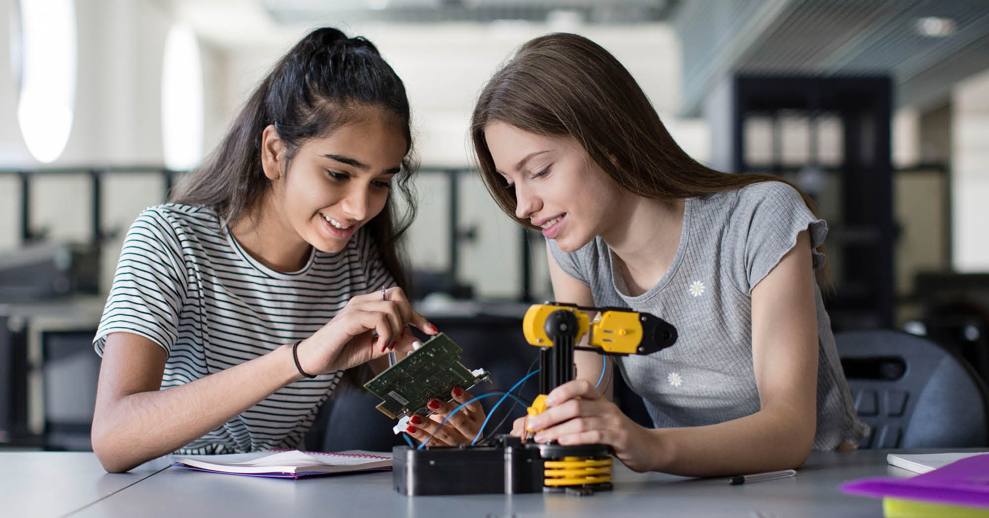 Two middle school students learning about robotics - STEAM