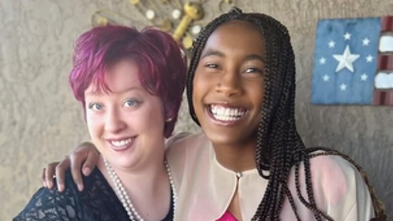 Two online school best friends smiling together