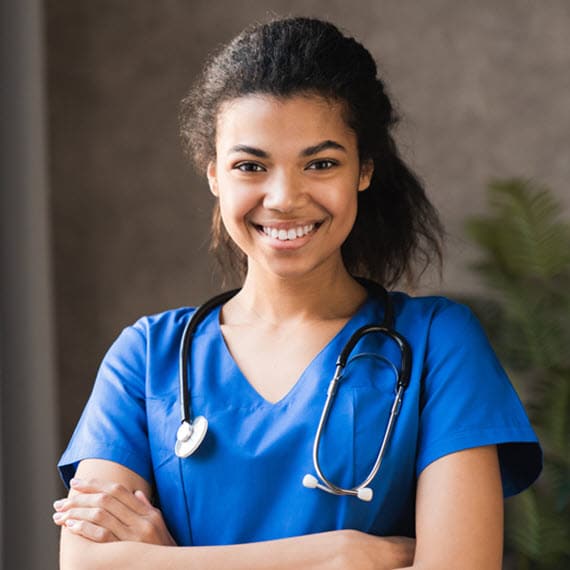 A young woman in nurse's uniform