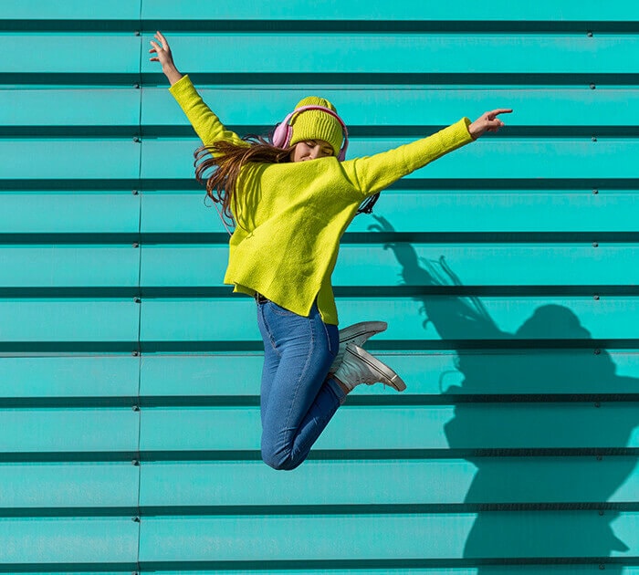 A young girl jumping in the air