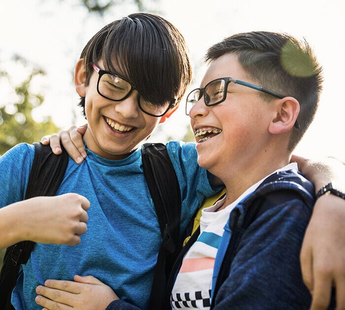 Two young boys laughing together