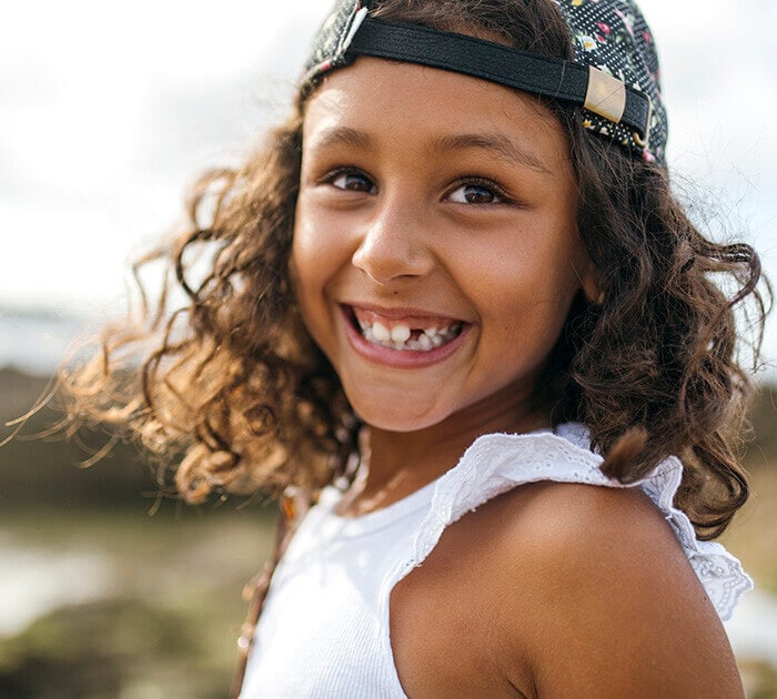 A young girl smiling