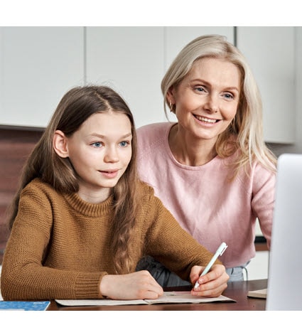 Mother and daughter working on a homeschool assignment