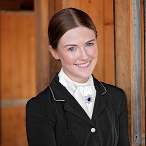 Image of Grace Davis, a senior at Colorado Connections Academy. She is wearing a black riding outfit.