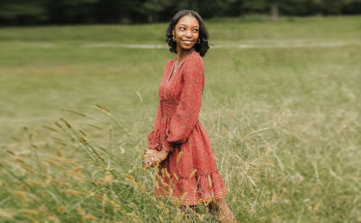Sierra from Georgia Connections Academy pictured here in a field of tall grass.