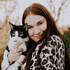 Image of Allayna from Indiana Connections Career Academy pictured here holding her cat.