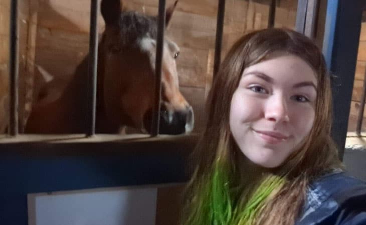 Brenna from Alabama Connections Academy stunting on her horse with a bow and arrow. 