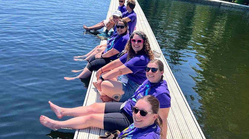 Maine Connections Academy teachers gathered on a dock