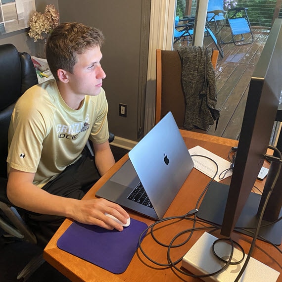 High school student doing schoolwork online at home - Connections Academy