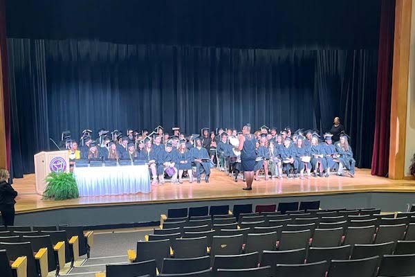 Students onstage at the Lighthouse Connections Academy graduation