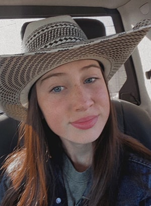 Image of Ava G in a black and white cowboy hat, she is student at Falcon View Connections Academy. 