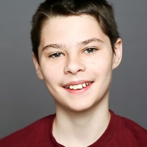 Image of James in a red shirt - a student at Minnesota's Falcon View Connections Academy