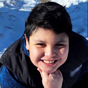 Image of Marley L in a black vest and blue shirt - a student at Minnesota's Falcon View Connections Academy
