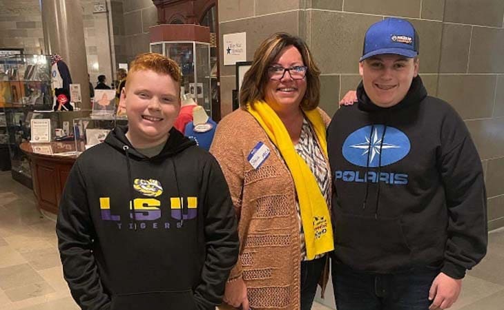 Dylan and Grant smiling with Ms. Barnard from Missouri Connections Academy.