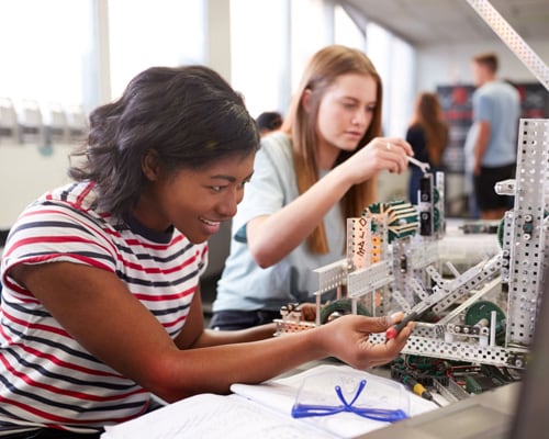 Teen female students working on a science experiement for an online assignment for Connections Academy.