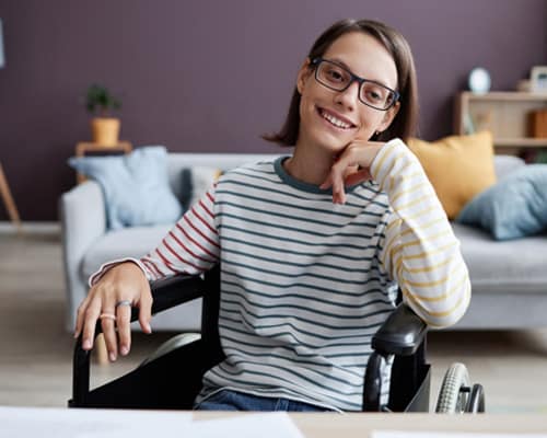 Connections Academy student working on a science project sitting in a wheelchair.