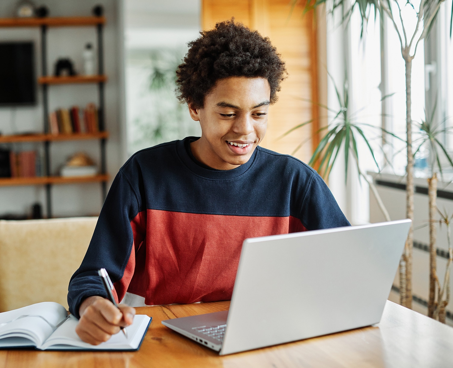High School Bridge Student working on his laptop