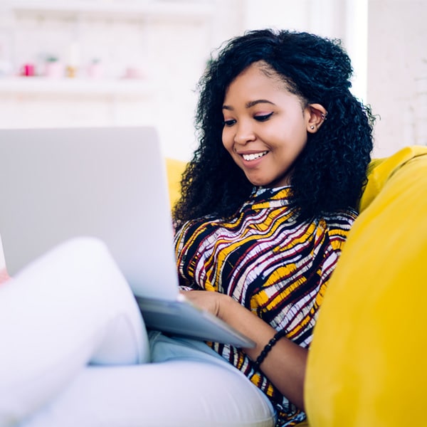 A student works on her laptop