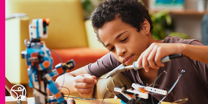 A young student builds a robort for a class at Connections Academy