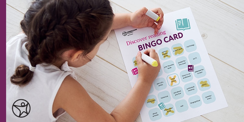 Young online student playing with the Connections Academy bingo card