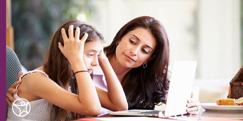 Student and learning coach talking about bullying