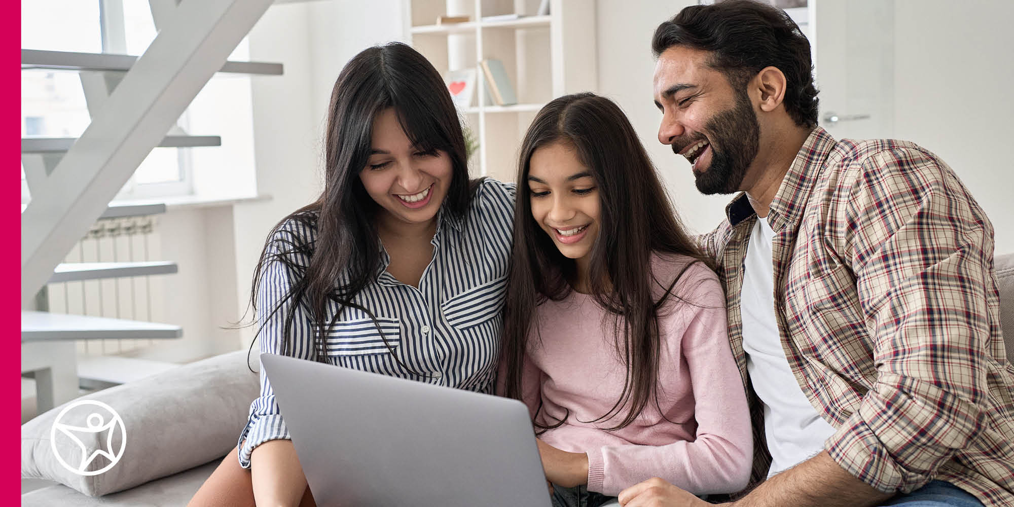 A student and her Learning Coaches happily looking at a laptop together