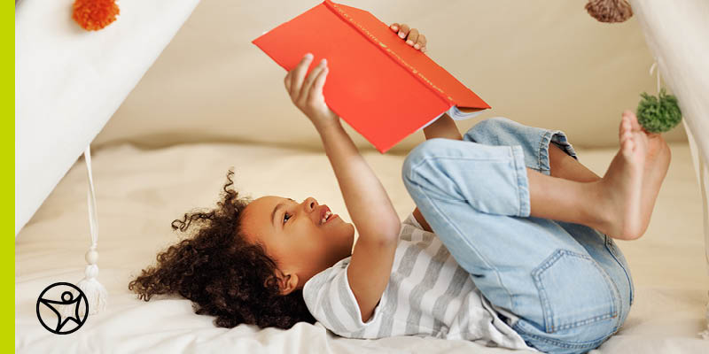 Child reading an age appropriate book