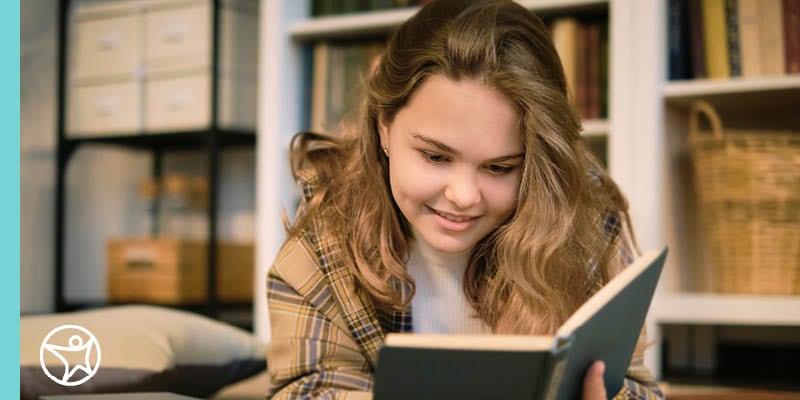 Online school student reading a book