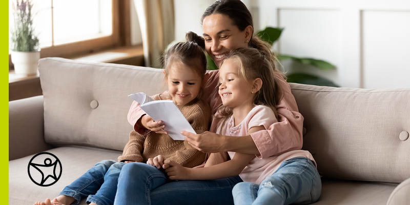 Learning Coach reading with two kindergarteners