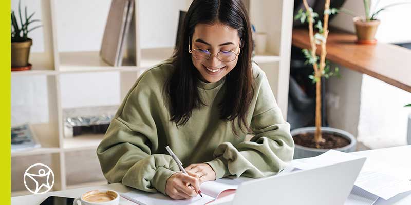 Student taking notes