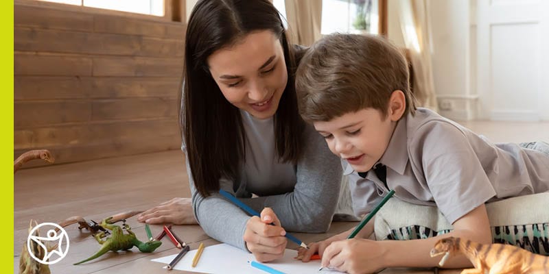 A mother and her son coloring together.