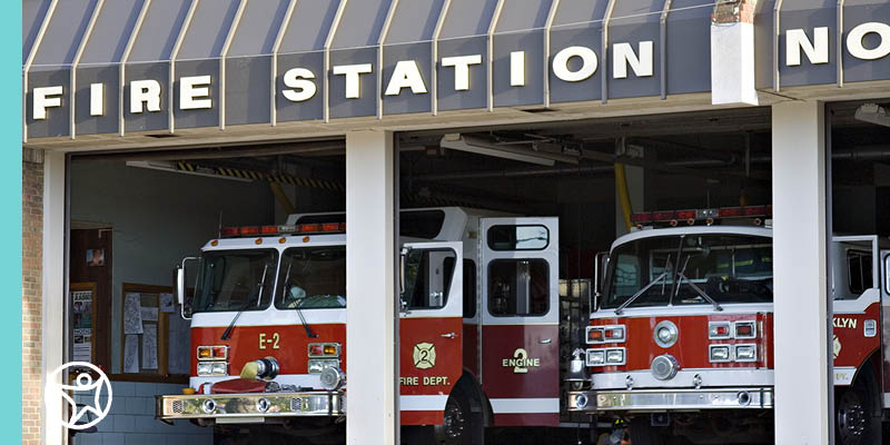 Image of fire trucks in a fire station