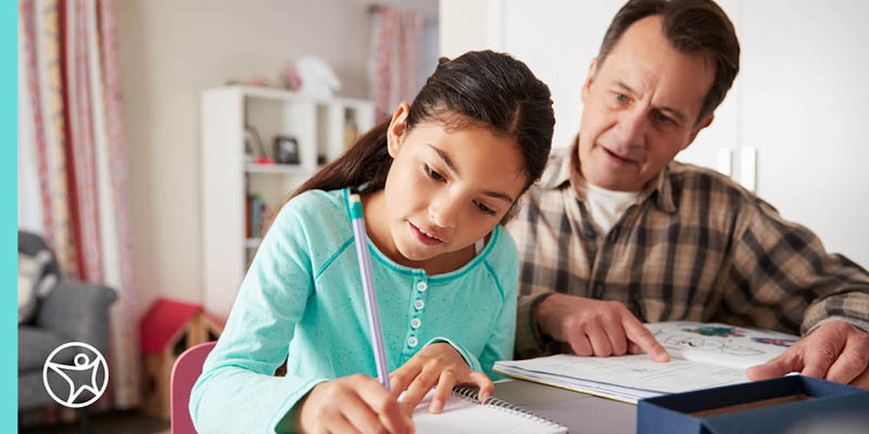 A young girl writing an essay