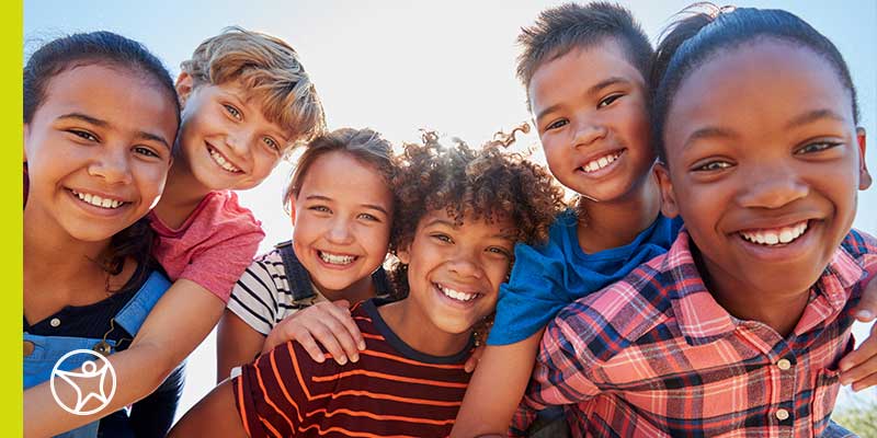 A group of six students smiling together for a fun photo