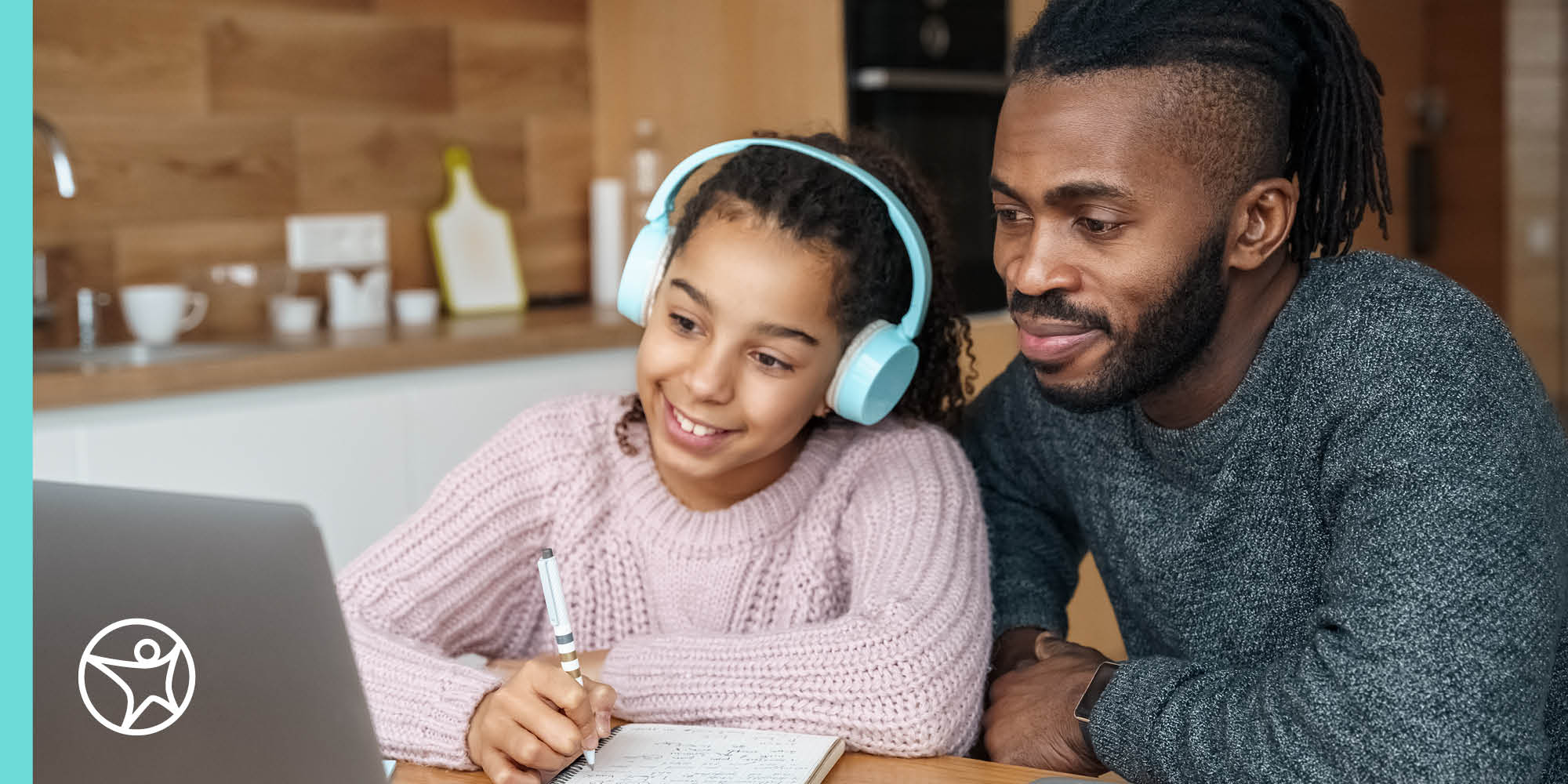 Dad helps elementary school daughter with school work