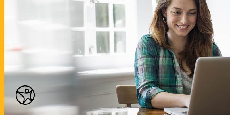 Student sitting at a desk working on a good letter of recommendation