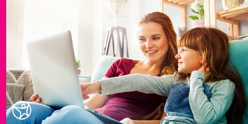Image of a young female student and her mom studying for a class for Connections Academy.