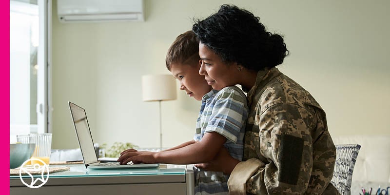 A military mother is helping her child take notes