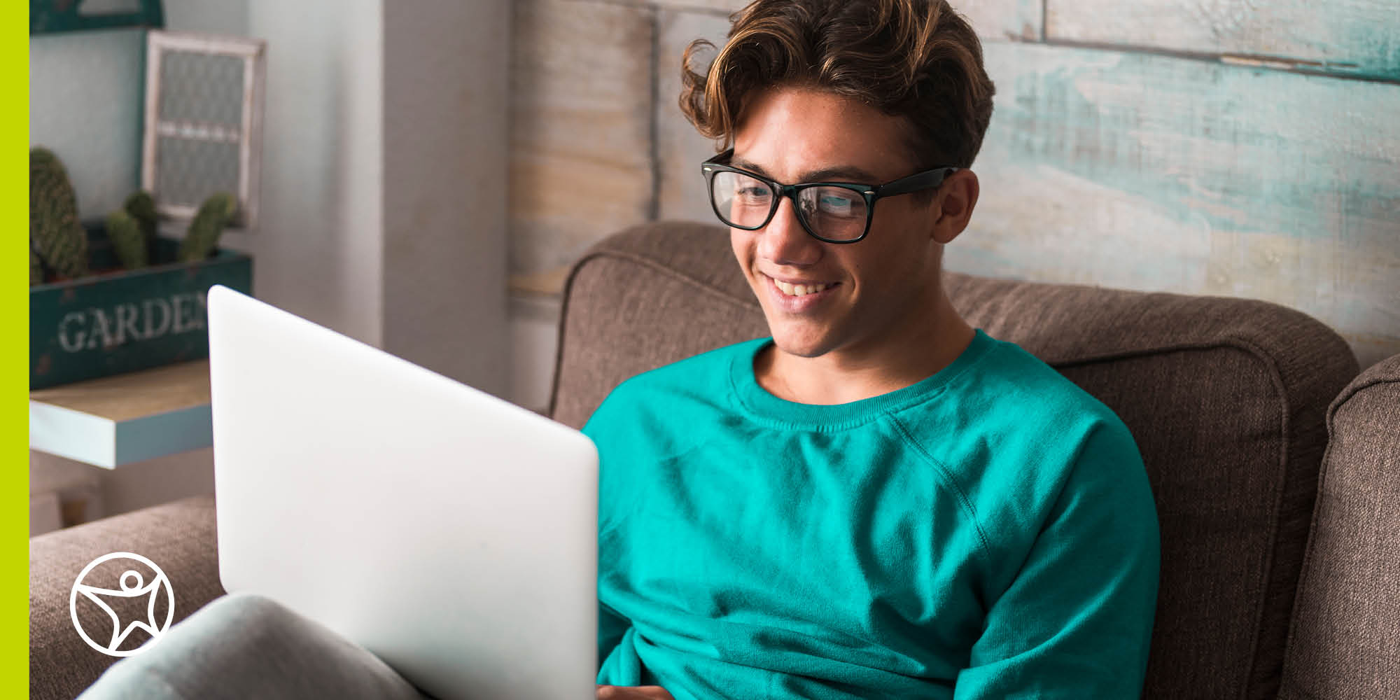 A high school student studyig on laptop computer