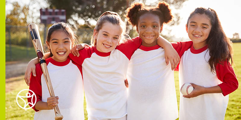 Four students socializing by playing sports