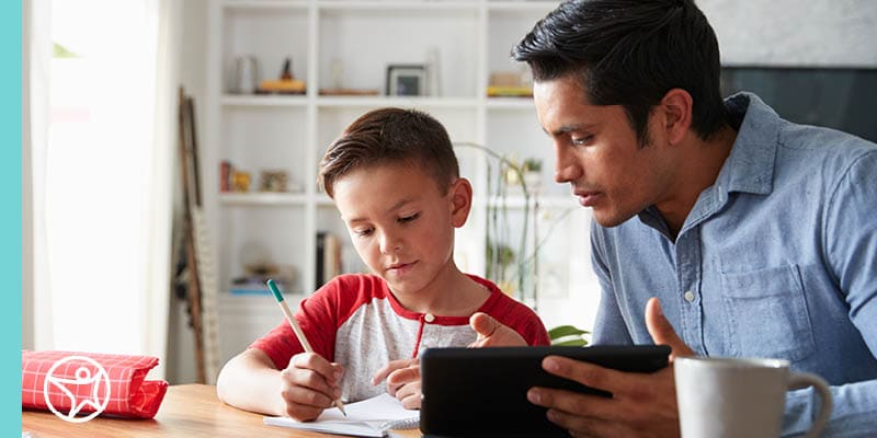 A learning coach and student go over homework.